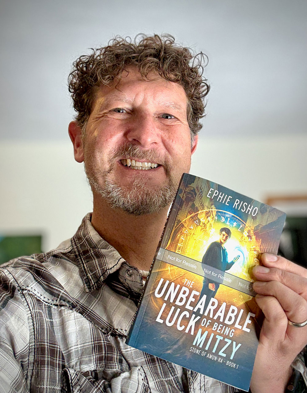 Ephie Risho with advance copy of The Unbearable Luck of Being Mitzy